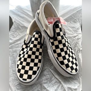 Vans black and white checkerboard slip on’s